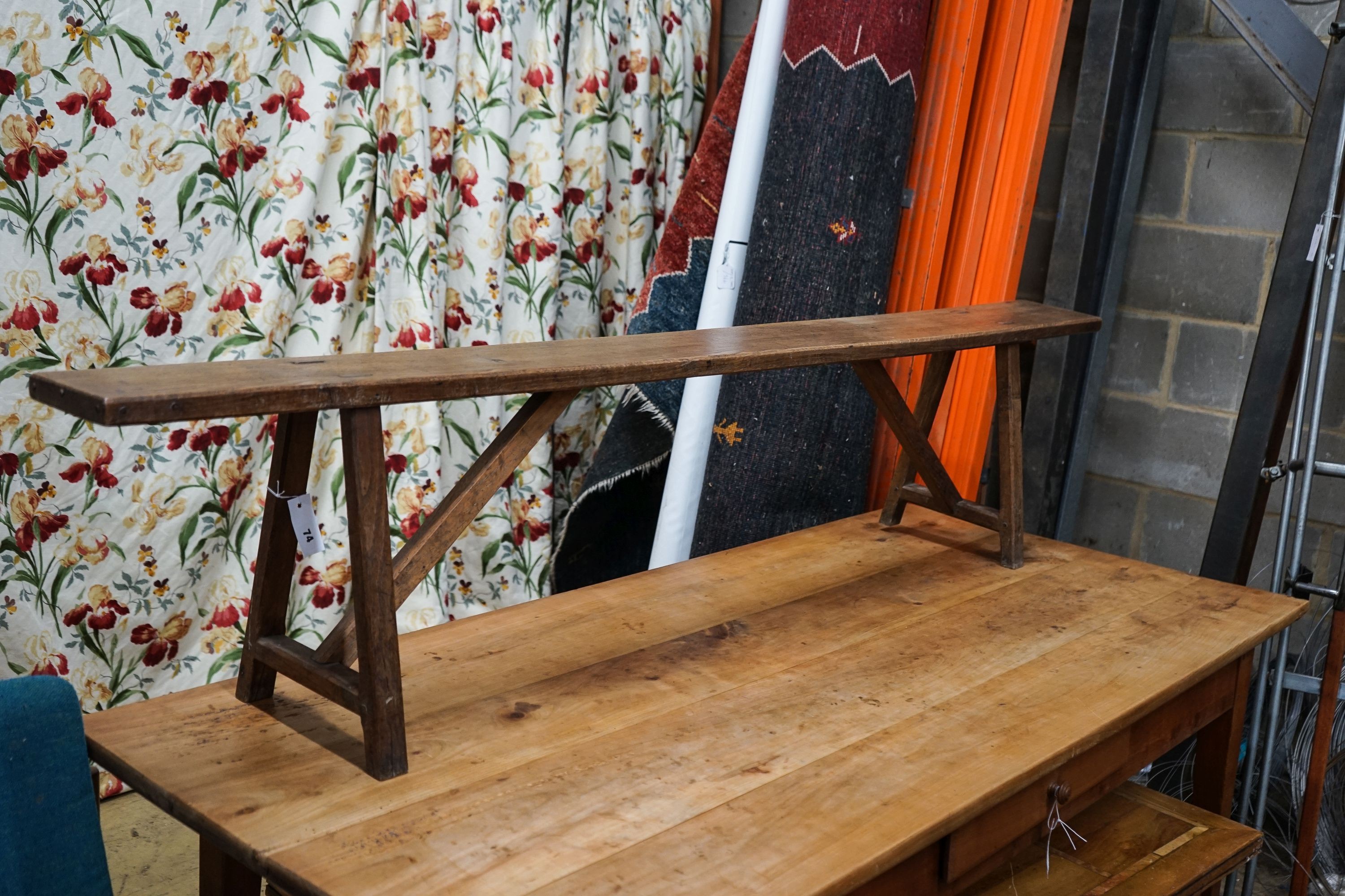 A 19th century French provincial oak bench seat, length 194cm, depth 30cm, height 42cm